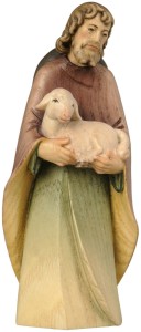 Shepherd standing with sheep